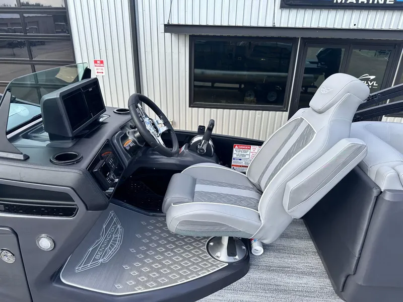 Slide: The Image of 2025 Bennington 22MFB boat interior with modern helm and comfortable captain's chair. - 21