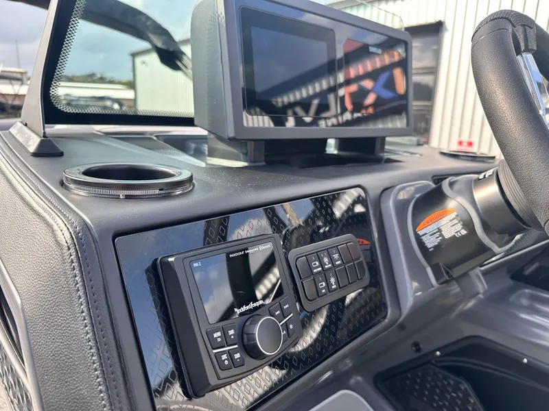 Slide: The Image of 2025 Bennington 22MFB dashboard with modern controls and steering wheel. - 24