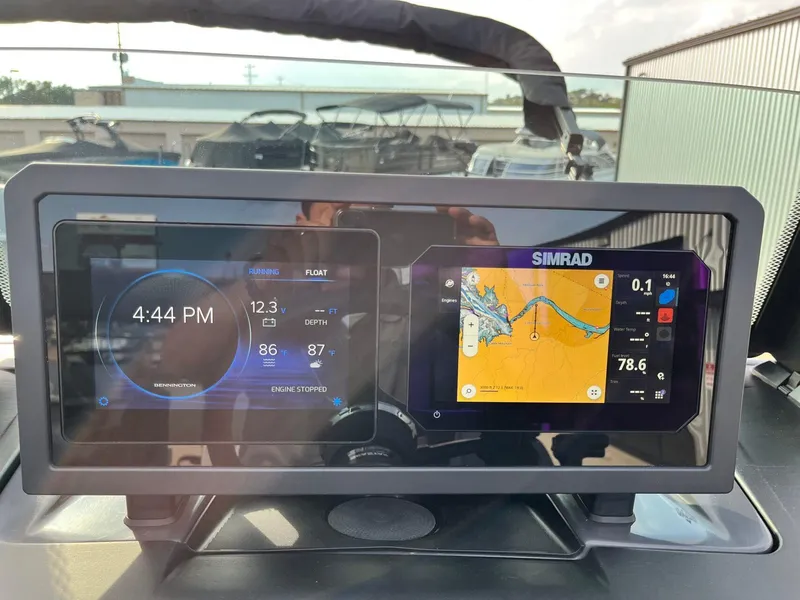 Slide: The Image of Dashboard of 2025 Bennington 22MFB with digital displays and navigation system. - 27