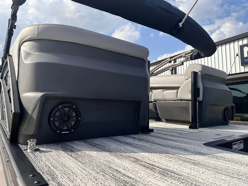 Slide: The Image of 2025 Bennington 22MFB pontoon boat interior with seating and speaker system. - 6