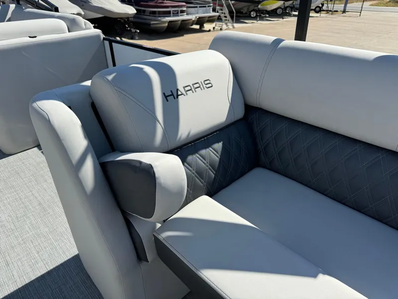 Slide: The Image of 2022 Harris Sunliner 250 boat seat with elegant gray upholstery and diamond stitching. - 10