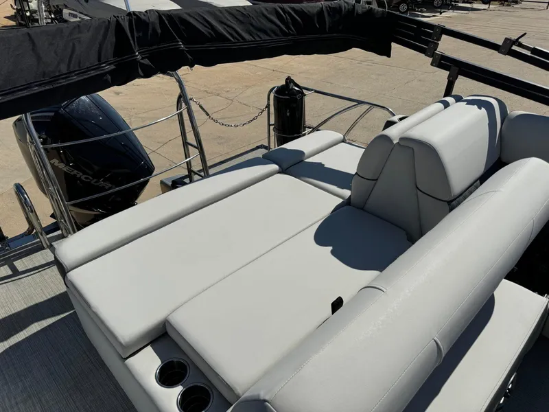 Slide: The Image of 2022 Harris Sunliner 250 boat with spacious seating and Mercury engine. - 22