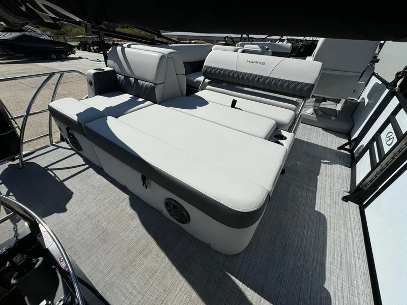 Slide: The Image of 2022 Harris Sunliner 250 boat interior with spacious seating and modern design. - 24
