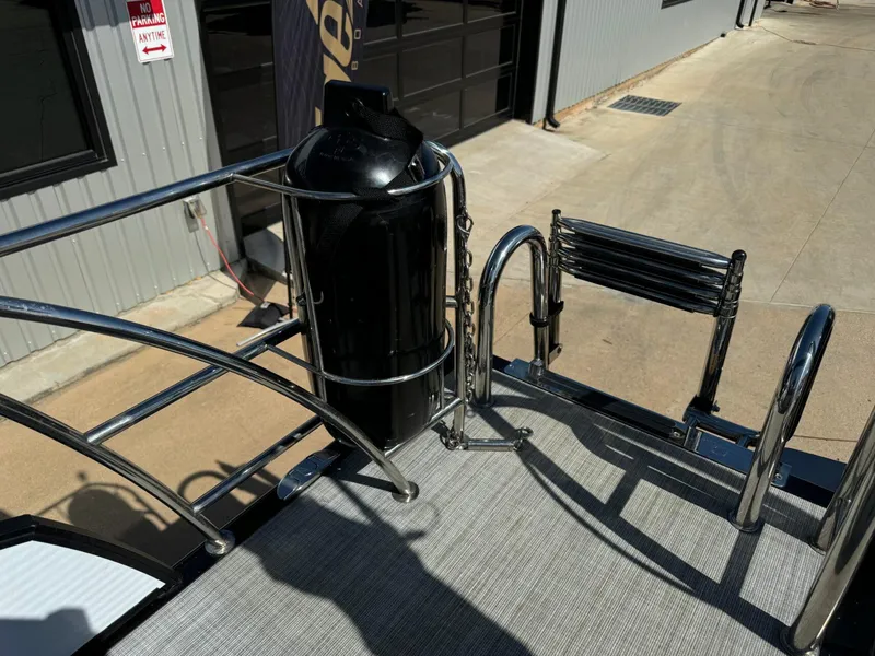 Slide: The Image of 2022 Harris Sunliner 250 boat deck with stainless steel railing and ladder. - 28