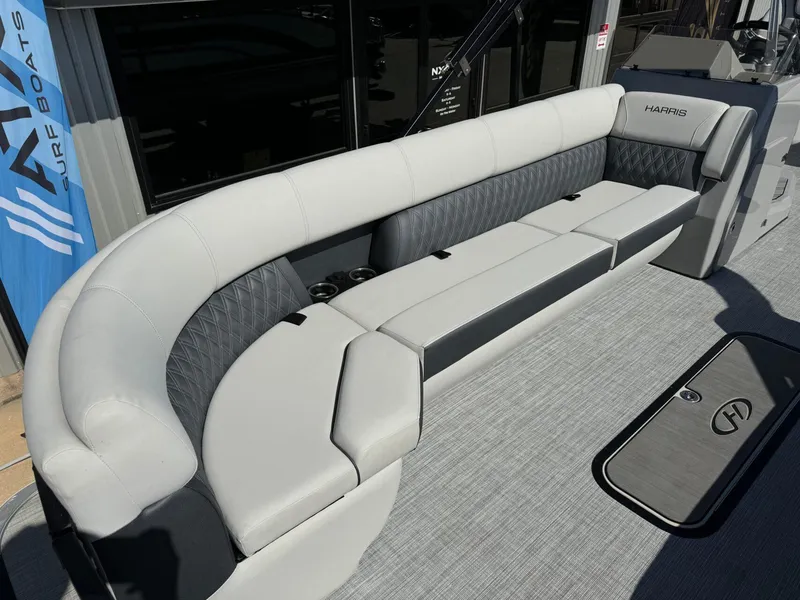 Slide: The Image of 2022 Harris Sunliner 250 boat interior with luxurious seating and modern design. - 8