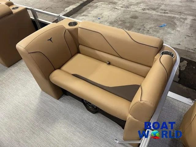 Slide: The Image of 2025 Tahoe Sport 23' Fish & Cruise boat seating with tan upholstery and cup holders. - 10