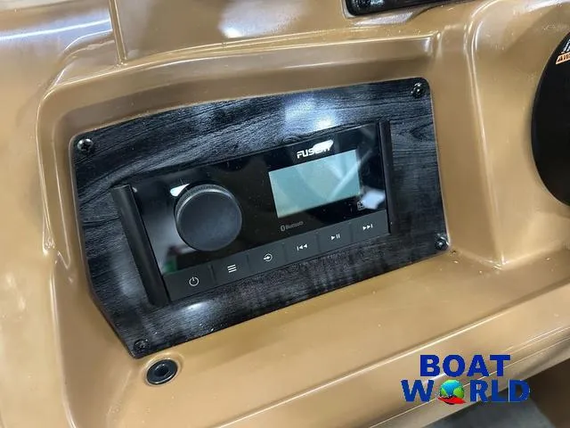 Slide: The Image of Dashboard of 2025 Tahoe Sport 23' Fish & Cruise with Fusion audio system. - 14