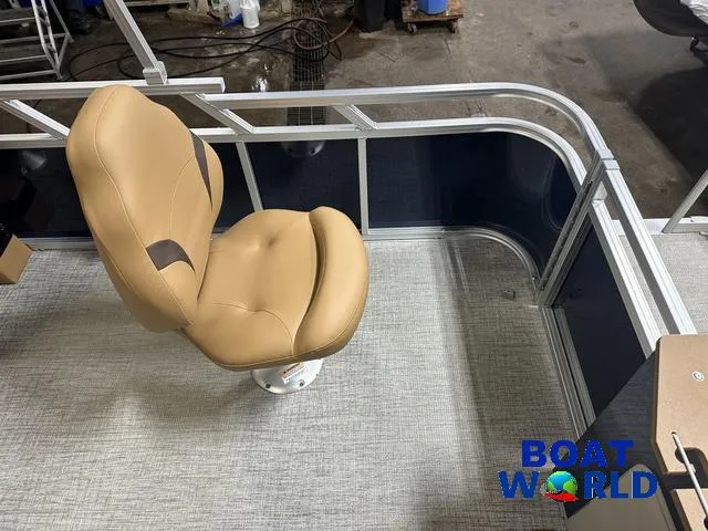 Slide: The Image of 2025 Tahoe Sport 23' Fish & Cruise boat interior with tan swivel seat. - 21