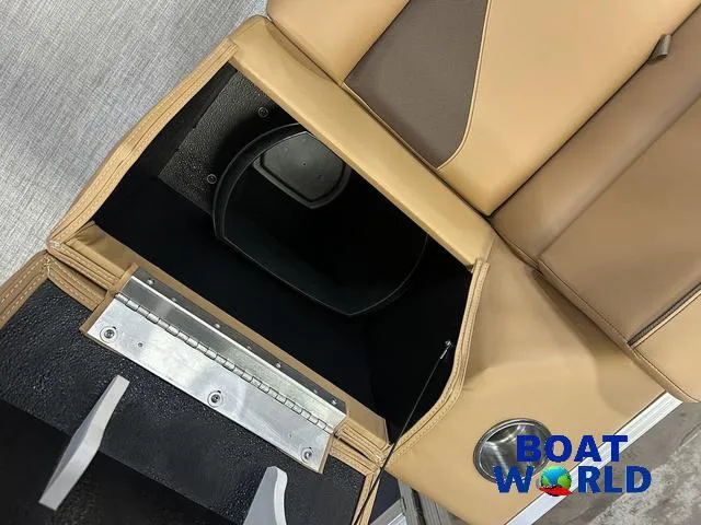 Slide: The Image of Tahoe Sport 23' Fish & Cruise boat seat storage compartment, 2025 model, with Boat World logo. - 24