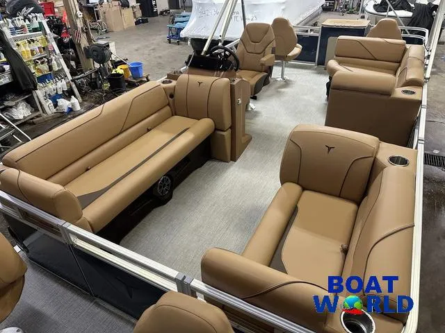 Slide: The Image of 2025 Tahoe Sport 23' Fish & Cruise boat interior with tan seating and Honda 4-Stroke EFI. - 34