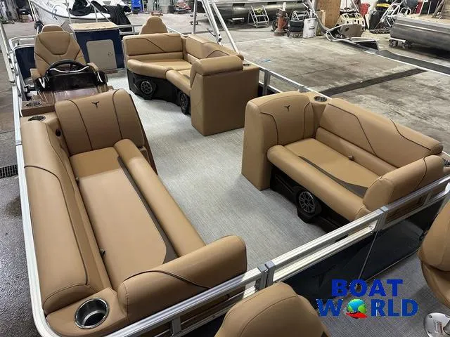 Slide: The Image of 2025 Tahoe Sport 23' Fish & Cruise boat interior with tan seating, showcased at Boat World. - 35