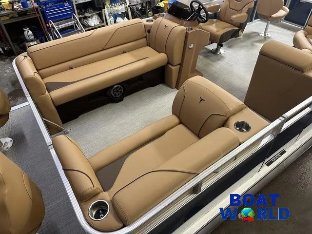 Slide: The Image of 2025 Tahoe Sport 23' Fish & Cruise interior with tan seating and modern design. - 4