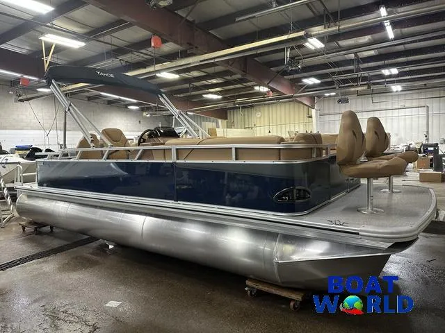 Slide: The Image of 2025 Tahoe Sport 23' Fish & Cruise pontoon boat in showroom, featuring Honda 4-Stroke EFI. - 49