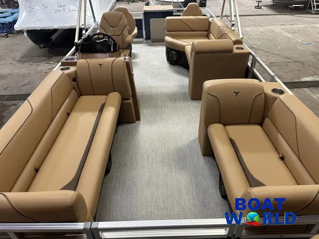 Slide: The Image of 2025 Tahoe Sport 23' Fish & Cruise boat interior with tan seating and spacious layout. - 8