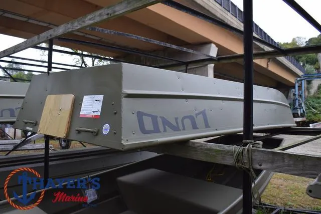 Slide: The Image of 2025 Lund 1040 Jon Boat Tiller displayed at Thayer's Marine. - 3