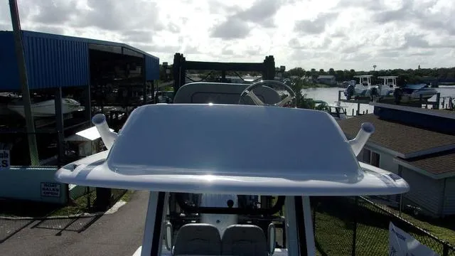 Slide: The Image of 2025 Sportsman Masters 247 boat at marina, overcast sky, waterfront view. - 11