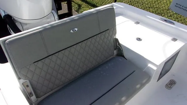 Slide: The Image of 2025 Sportsman Masters 247 boat interior with quilted seating and sleek design. - 14