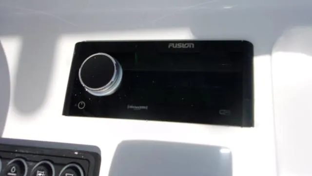 Slide: The Image of Fusion stereo system on 2025 Sportsman Masters 247 boat dashboard. - 17
