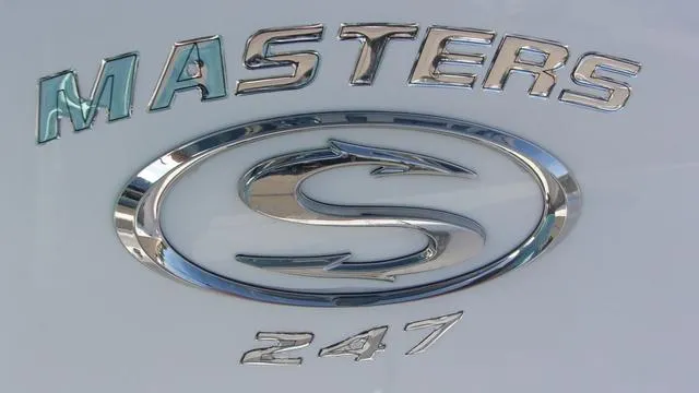 Slide: The Image of 2025 Sportsman Masters 247 logo with sleek chrome design. - 20