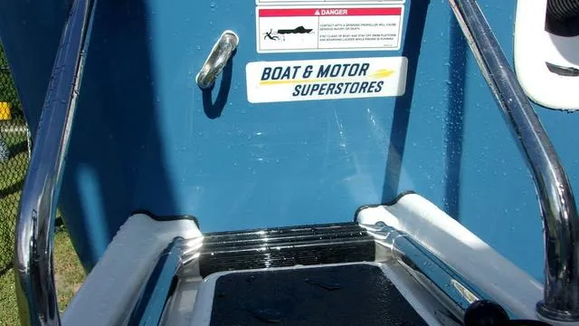 Slide: The Image of Sportsman Masters 247 boat ladder with safety warning and store logo, 2025 model. - 4