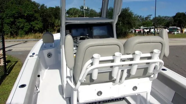 Slide: The Image of 2025 Sportsman Masters 247 boat interior with dual seats and rod holders. - 6