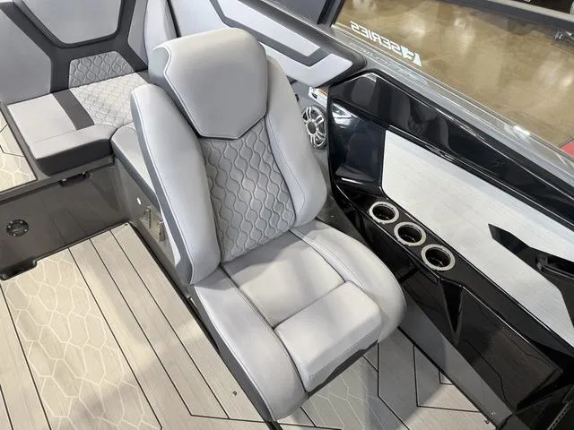 Slide: The Image of 2025 Yamaha Boats 222XE interior with sleek gray seating and modern design. - 14