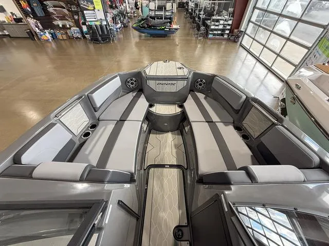 Slide: The Image of 2025 Yamaha Boats 222XE interior with spacious seating and modern design. - 21