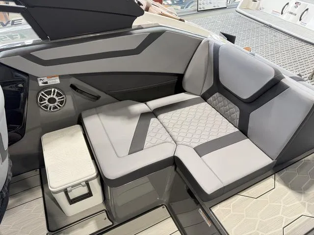 Slide: The Image of 2025 Yamaha Boats 222XE interior seating with modern design and gray upholstery. - 8