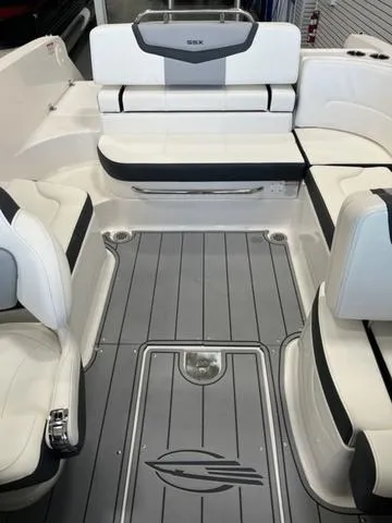 Slide: The Image of Interior of 2025 Chaparral 247 SSX boat with seating and cup holders. - 10