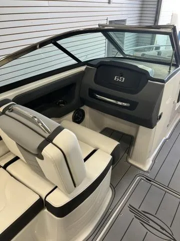 Slide: The Image of 2025 Chaparral 247 SSX boat interior with sleek seating and modern dashboard design. - 7