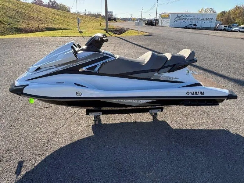 Slide: The Image of 2015 Yamaha Waverunner VX Cruiser jet ski on display in a parking lot. - 11