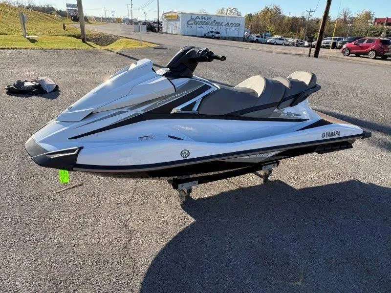 Slide: The Image of 2015 Yamaha Waverunner VX Cruiser jet ski parked on asphalt in sunny setting. - 12