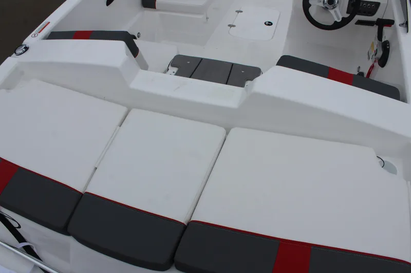 Slide: The Image of 2025 Tahoe T18 boat interior with cushioned seating and modern design. - 16