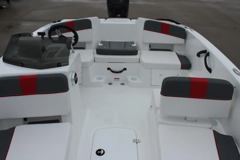 Slide: The Image of 2025 Tahoe T18 boat interior with modern seating and steering console. - 18