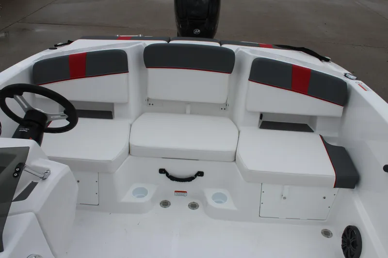 Slide: The Image of 2025 Tahoe T18 boat interior with white and gray seating. - 19