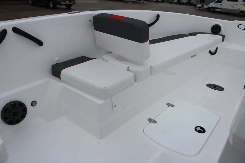 Slide: The Image of 2025 Tahoe T18 boat interior with white seating and storage compartments. - 22