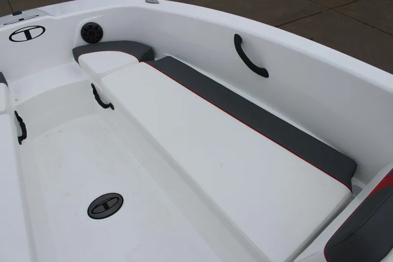 Slide: The Image of 2025 Tahoe T18 boat interior with white and gray seating. - 25