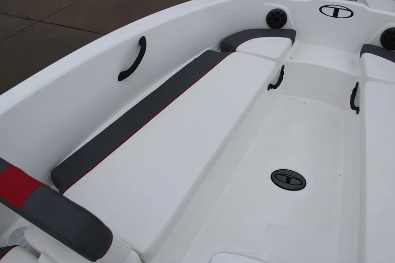 Slide: The Image of 2025 Tahoe T18 boat interior with white and gray seating. - 26