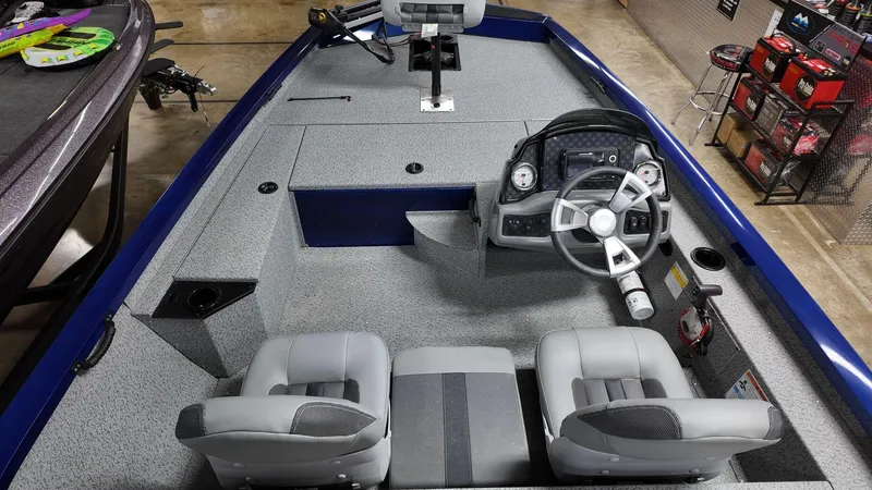 Slide: The Image of 2023 G3 Sportsman 1610 boat interior with steering console and seating. - 4