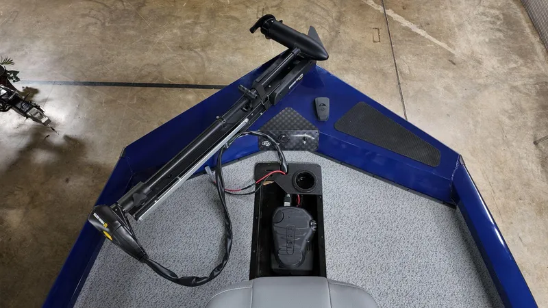 Slide: The Image of 2023 G3 Sportsman 1610 boat interior with trolling motor and storage compartment. - 5