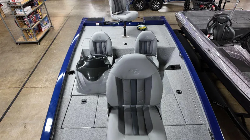 Slide: The Image of 2023 G3 Sportsman 1610 boat interior with gray seating and storage compartments. - 6