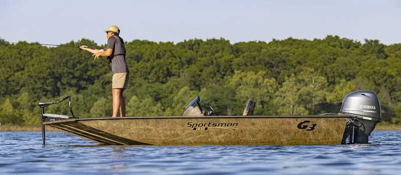 Slide: The Image of 2023 G3 Sportsman 1610 boat on a lake with a person fishing. - 8