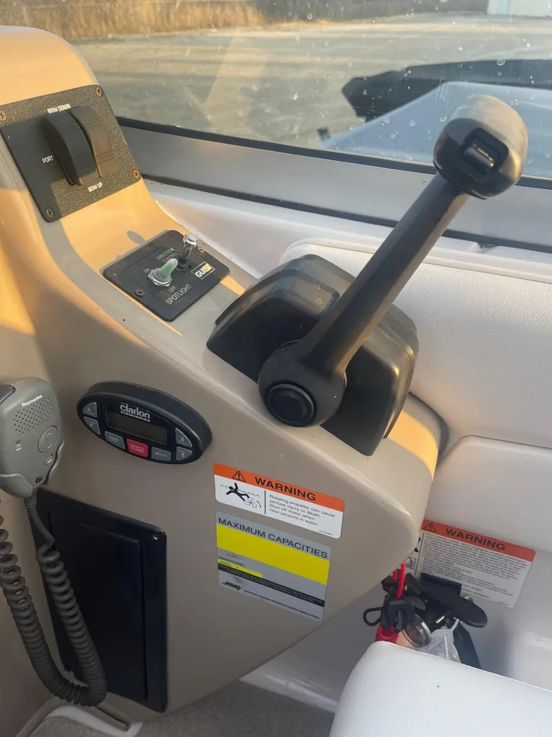 Slide: The Image of Control panel of 2005 Four Winns 248 Vista boat with throttle and warning labels. - 13