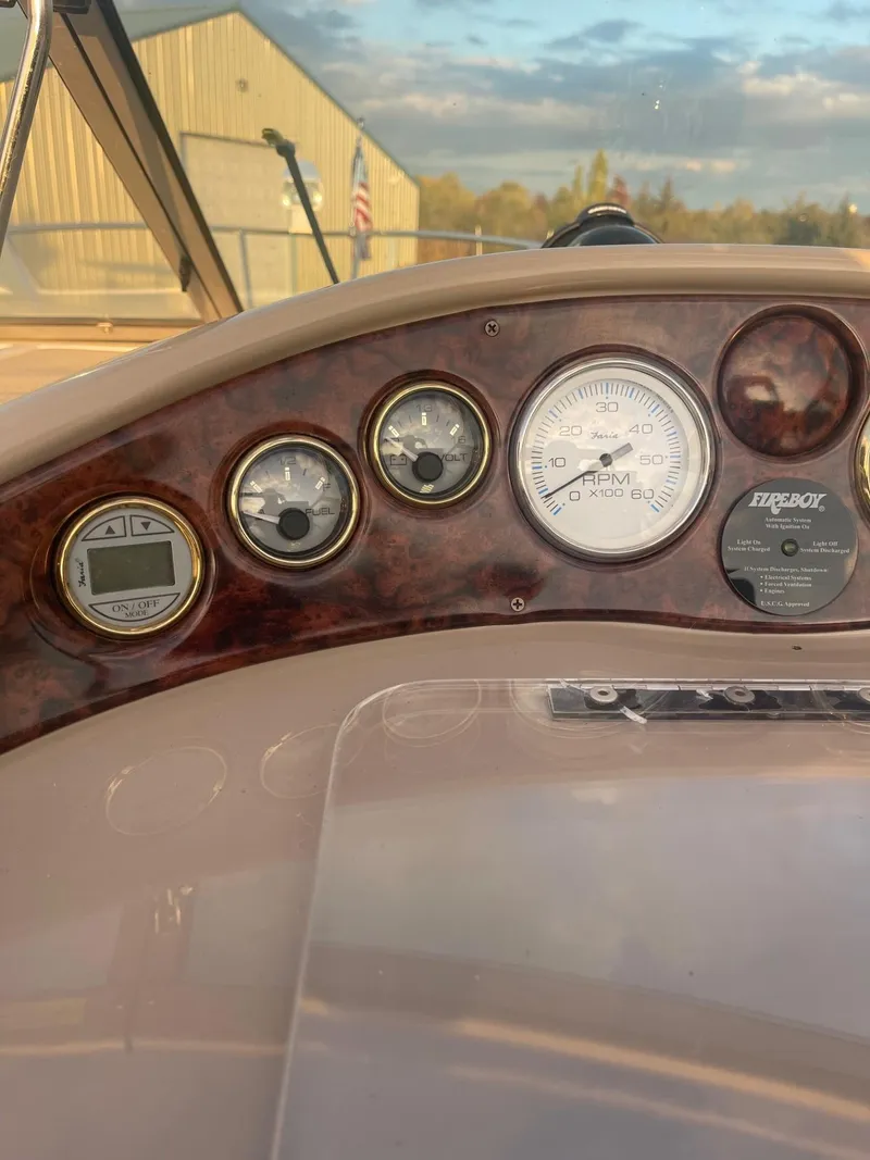 Slide: The Image of 2005 Four Winns 248 Vista boat dashboard with gauges and controls. - 15