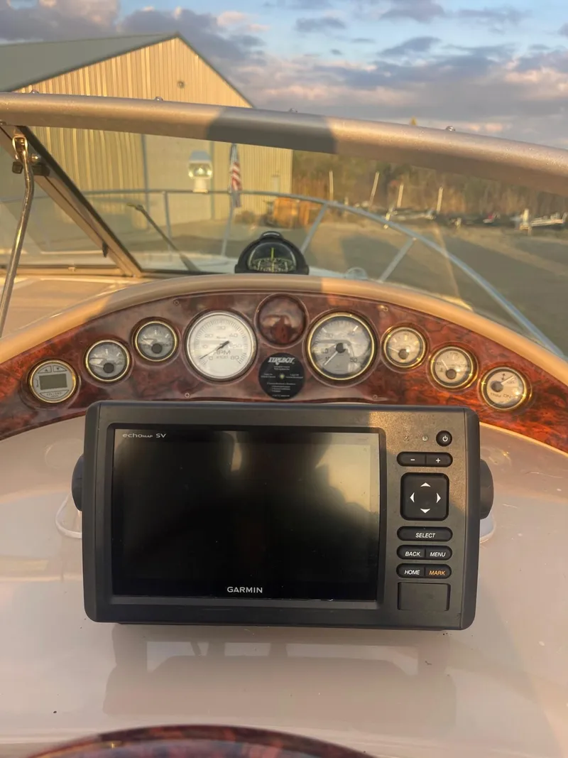 Slide: The Image of 2005 Four Winns 248 Vista dashboard with Garmin navigation system. - 17