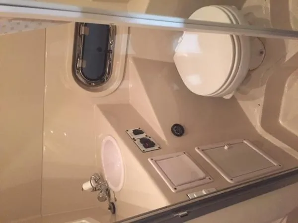 Slide: The Image of 2005 Four Winns 248 Vista boat bathroom with toilet and sink. - 21