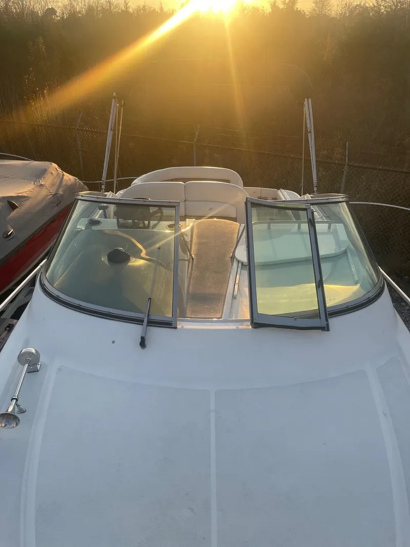 Slide: The Image of 2005 Four Winns 248 Vista boat at sunset, front view. - 29