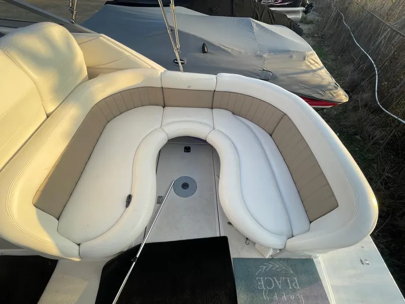 Slide: The Image of 2005 Four Winns 248 Vista boat with beige and white seating area. - 5