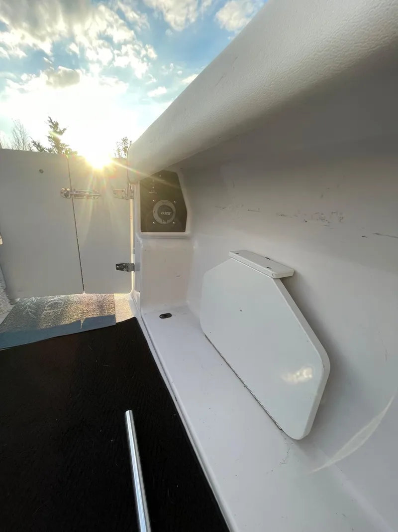 Slide: The Image of 2005 Four Winns 248 Vista boat interior with sunlight and sleek design. - 7