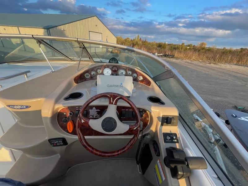 Slide: The Image of 2005 Four Winns 248 Vista boat dashboard with Garmin navigation system. - 9